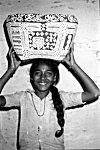 Girl Carrying Painted Basket