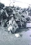 Woman Guarding Washed up Wood