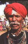 Folk Artist in Red Rumal