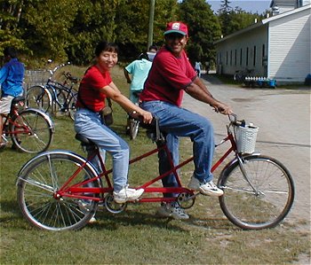 Kim and Vikas on a Tandem Bike